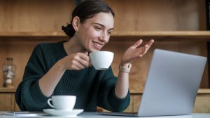 Woman at her computer learning how to use ChatGPT for the first time and getting tips for beginners.