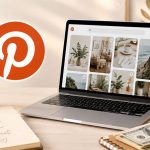 Laptop displaying Pinterest with home decor images sits on a desk with a notebook, pen, coffee cup, houseplants, and cash—hinting at ways to make money on Pinterest. The Pinterest logo is prominently shown in the background.